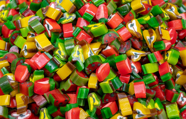 Fototapeta na wymiar A bunch of colorful marshmallows and sweets. Concept : sweets at a children's party, extra calories, a yummy store.