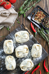 Traditional steamed dumplings Manti with Tomato sauce