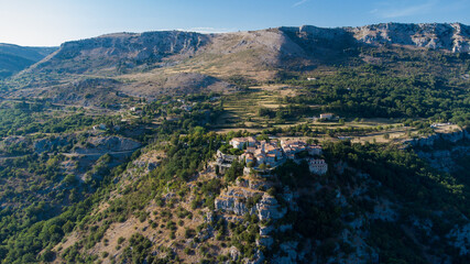 Fototapeta na wymiar Aerial view of the medieval village of Gourdon in Provence, France - Stone houses built on the edge of a cliff in the mountains of the Gorges du Loup on the French Riviera