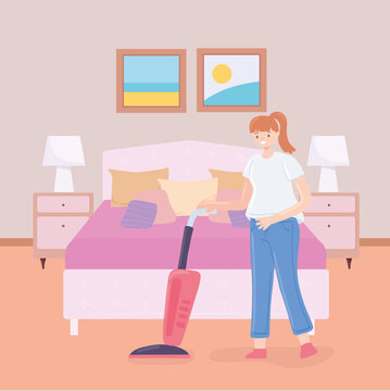 woman with vacuum in bedroom
