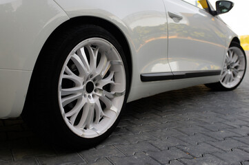 White car rims. Automobile wheels. Alloy wheels of a car.