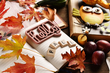 Hello Fall background with a diary notebook and colorful leaves