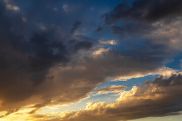 Fototapeta na wymiar Beautiful bright sunset sky with clouds. Sky background.