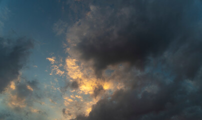 Beautiful bright sunset sky with clouds. Sky background.