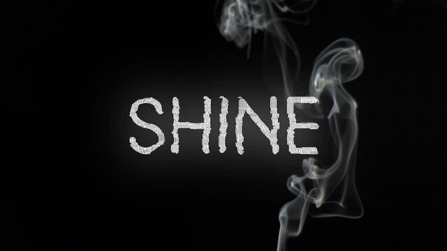 Animation of shine in white text with distortion over smoke on black background