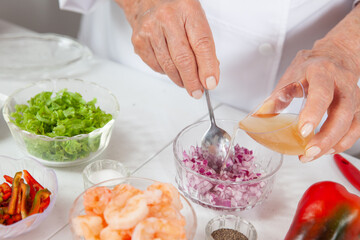 Obraz na płótnie Canvas Close-up of the preparation process of a delicious shrimp ceviche