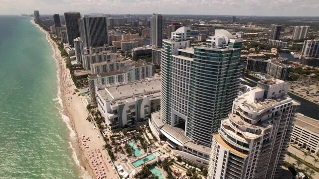 Aerial fly around The Diplomat Hollywood. 5k drone footage beach resorts