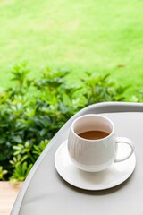 The coffee mug placed on the wood table top