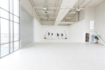 Empty wide and tall indoor industrial design photography studio workshop room full of space and...