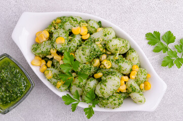 Gnocchi with corn and green sauce