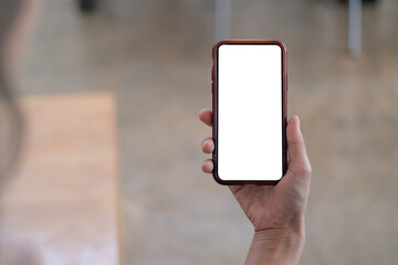 A Woman excited surprise and showing cell phone screen. Blank screen for your advertising.