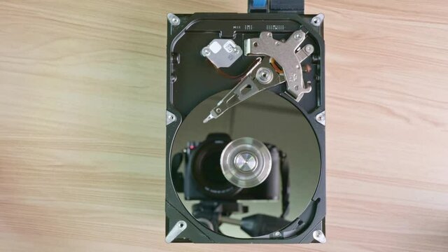 The hard disk has been opened to reveal the functions inside such as reading, writing and overview of devices.
