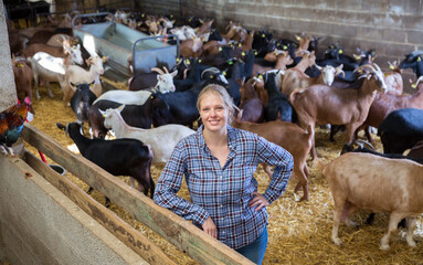 Positive woman owner of dairy farm. High quality photo