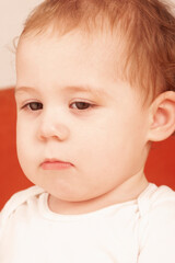 portrait of caucasian baby with angry expression