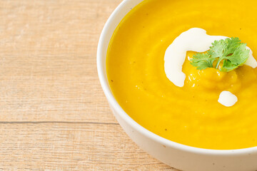 pumpkin soup in white bowl