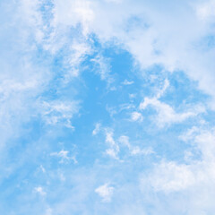 Naklejka na ściany i meble Background of blue sky with beautiful natural white clouds.