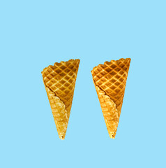 Empty wafer ice cream cones on blue background, Delicious ice-cream cone on blue , Banner design.