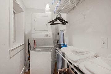 small stackable laundry room and closet combo