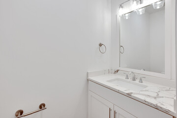 Bathroom with bathtub and shower in new luxury home with all glass shower. 