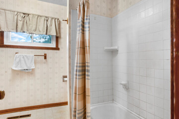 Small titled bathroom with white tiles