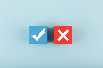 True and false symbol on blue and red cubes against bright pastel blue background. Concept of accept and reject, true or false, right or wrong - obrazy, fototapety, plakaty
