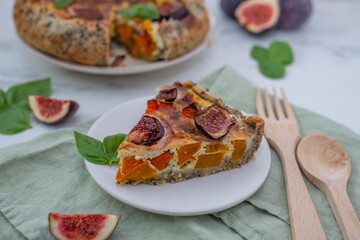 home made autumn quiche with pumpkin and figs