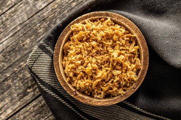 Pieces of fried onions in bowl.