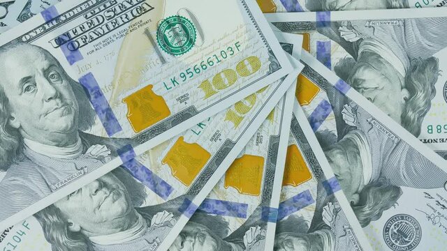 The dollar on the turntable. The dollar spin rotate. Twist, create pattern, make design shape circle.