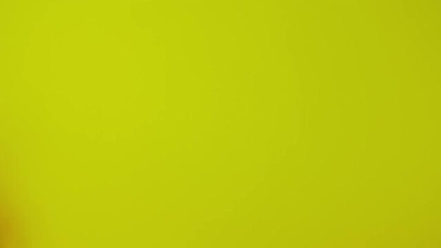 The dollar spin rotate quickly fast fly, dispart, splash to the sides with centrifugal coriolis force. The video is in reverse. Dollar twist, create pattern, make design shape circle picture.