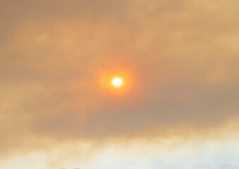 sun covered by smog from fire