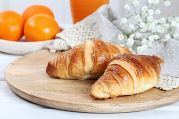 French croissants and mandarines on the table