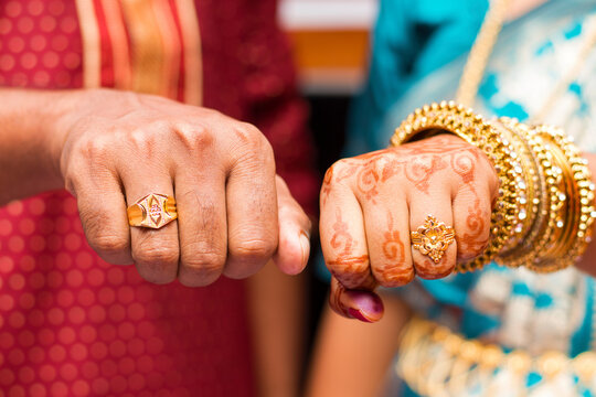 Wedding Ceremony. Close Up Of Groom Putting Golden Ring On The Bride's  Finger. Stock Photo, Picture and Royalty Free Image. Image 152971543.