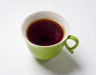 Mug of tea on a white background. View from above. Studio photography