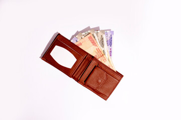 Wallets with Indian currency isolated on white background.