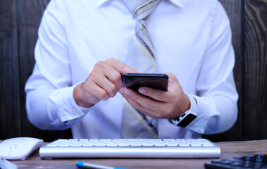 A businessman types on a computer keyboard. Banking and strategy formulation A financial analyst is at work in the workplace. Accounting for businesses and project management