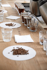 Barista pouring water to coffee cups