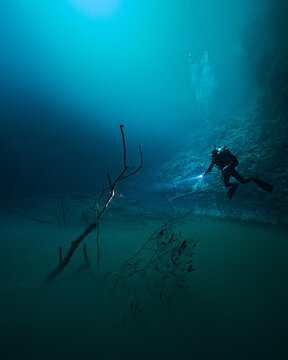 diving in Cenote Angelita with foggy halocline in mexico