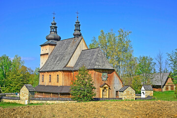 Roman catholic wooden church St. St. Peter and Paul from Lososina Dolna built in 1739, ethnographic park in Nowy Sacz, Poland - obrazy, fototapety, plakaty