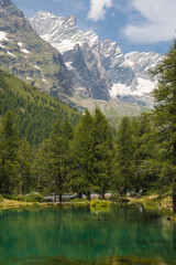 Idyllic lake with high alps in the background during summer season, Valtournenche, Aosta Valley, Italy