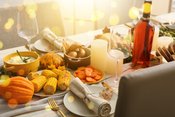 Beautiful table setting with different food for Thanksgiving Day celebration in dining room
