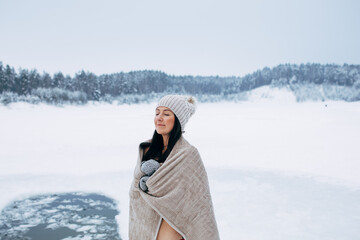 Winter swimming. Woman ready to swim in ice water. How to swim in cold water. Beautiful young woman...