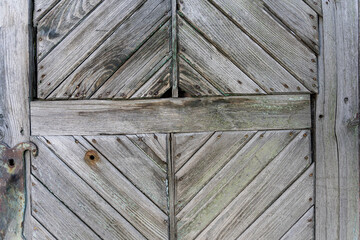 Fototapeta premium Elements of old wooden doors with diamond-shaped discs