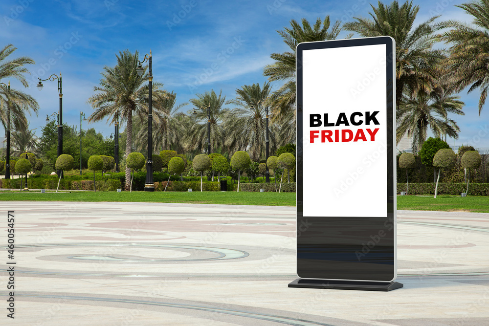 Poster trade show lcd screen stand display billboard with black friday sale sign in empty city street with 