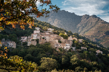 Fototapeta na wymiar The village of Nessa in the Balagne region of Corsica with mountains behind
