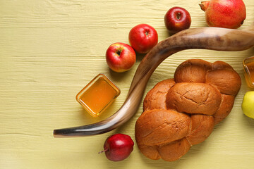 Symbols of Rosh hashanah (Jewish New Year) on color wooden background