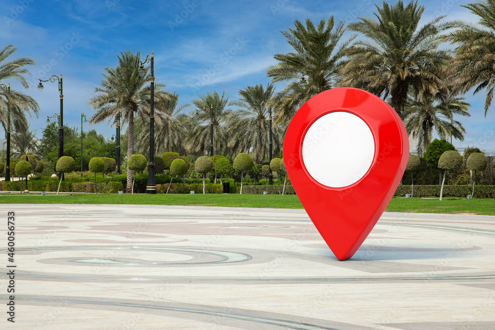 Poster Red Map Pointer Pin in Empty City Street with Palm Trees. 3d Rendering