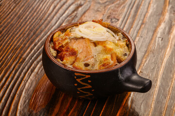 Casserole cocotte with baked cheese