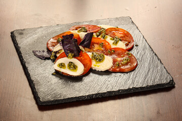 Italian caprese salad with mozzarella and cheese