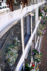 Several well-preserved niches with bouquets of flowers