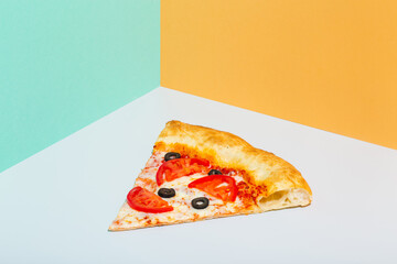 slice of pizza margarita on paper grey and orange background